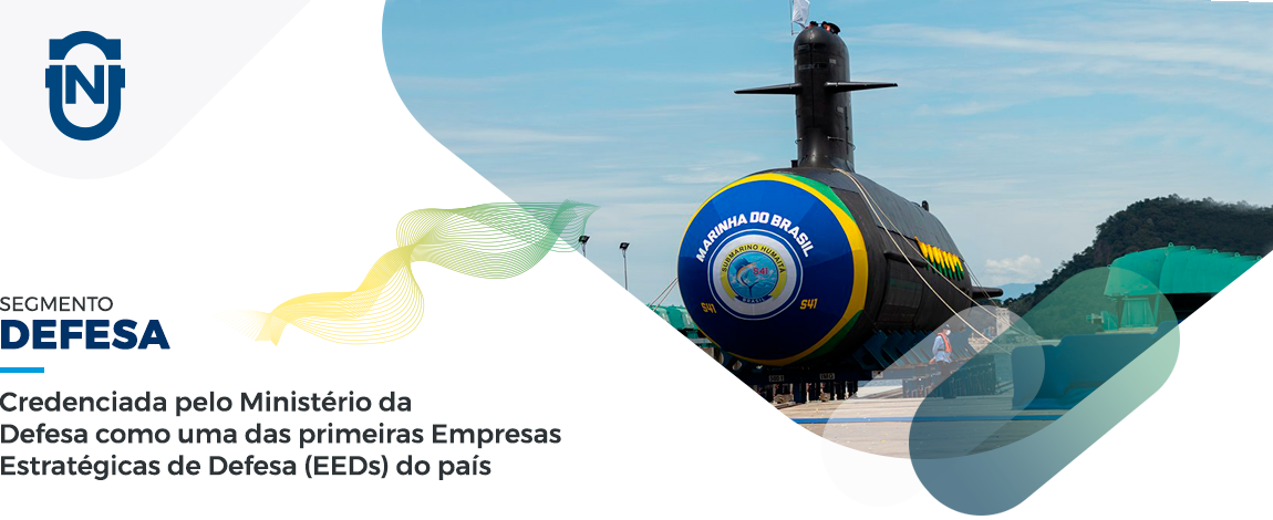 Imagem de cabeçalho de página do setor de defesa, mostrando um submarino em um porto no dia de sua inauguração.
